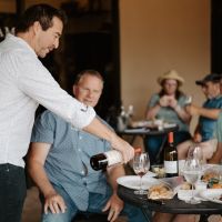 Frank pouring for wine club members