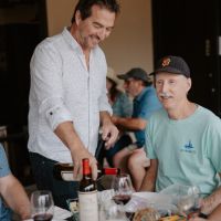 Frank pouring for wine club members